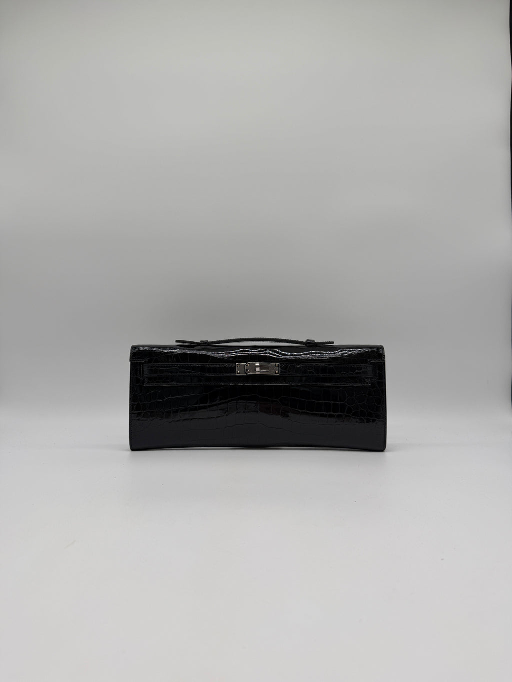 Hermès Kelly Cut Black Shiny Porosus Palladium Hardware