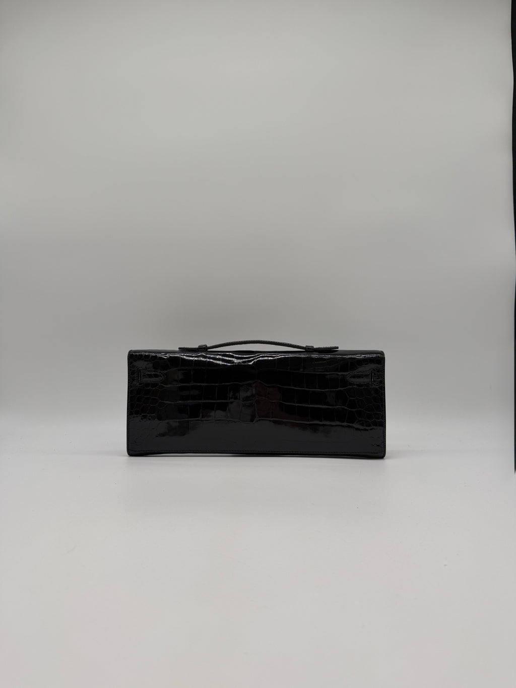 Hermès Kelly Cut Black Shiny Porosus Palladium Hardware