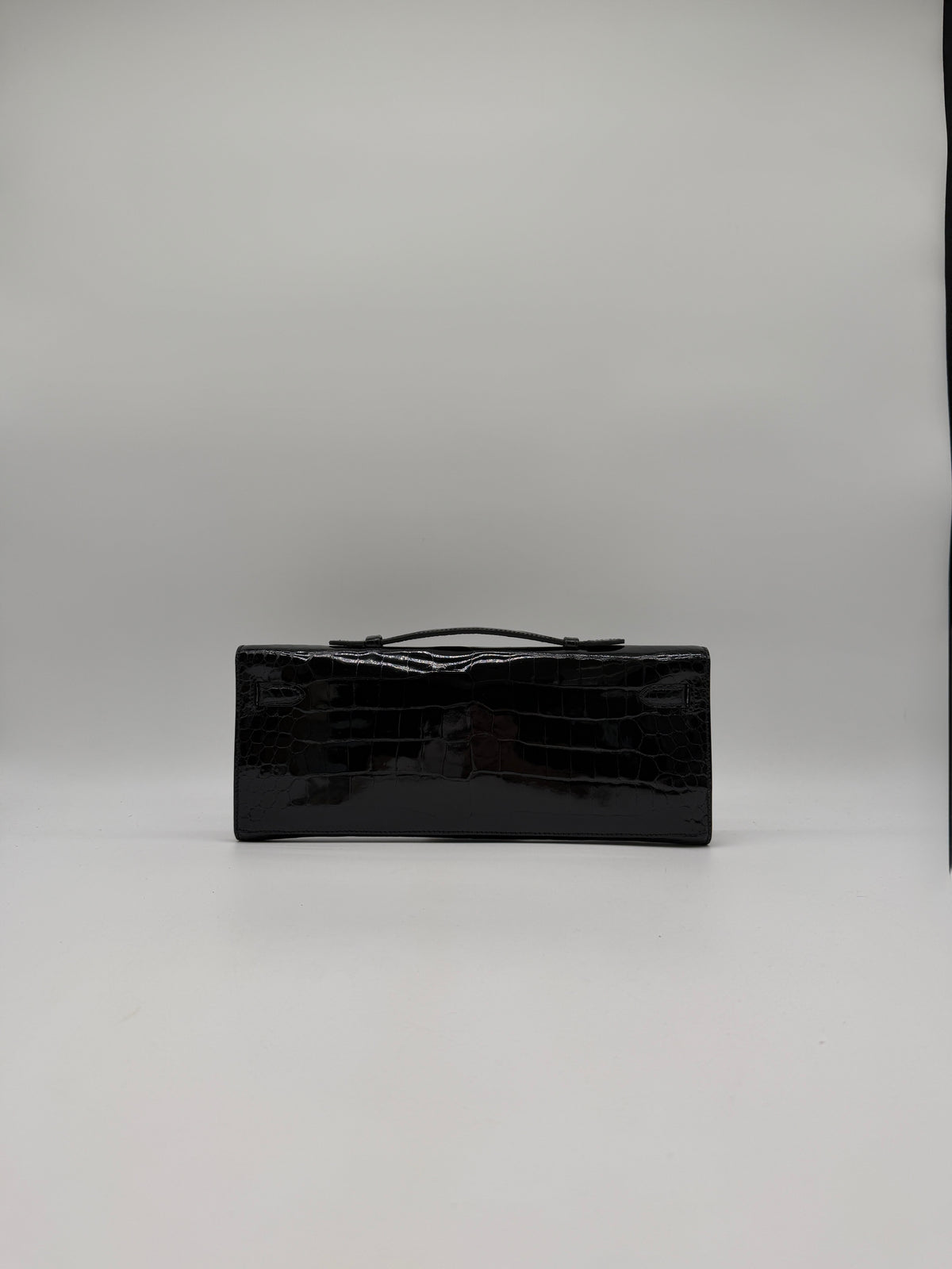 Hermès Kelly Cut Black Shiny Porosus Palladium Hardware