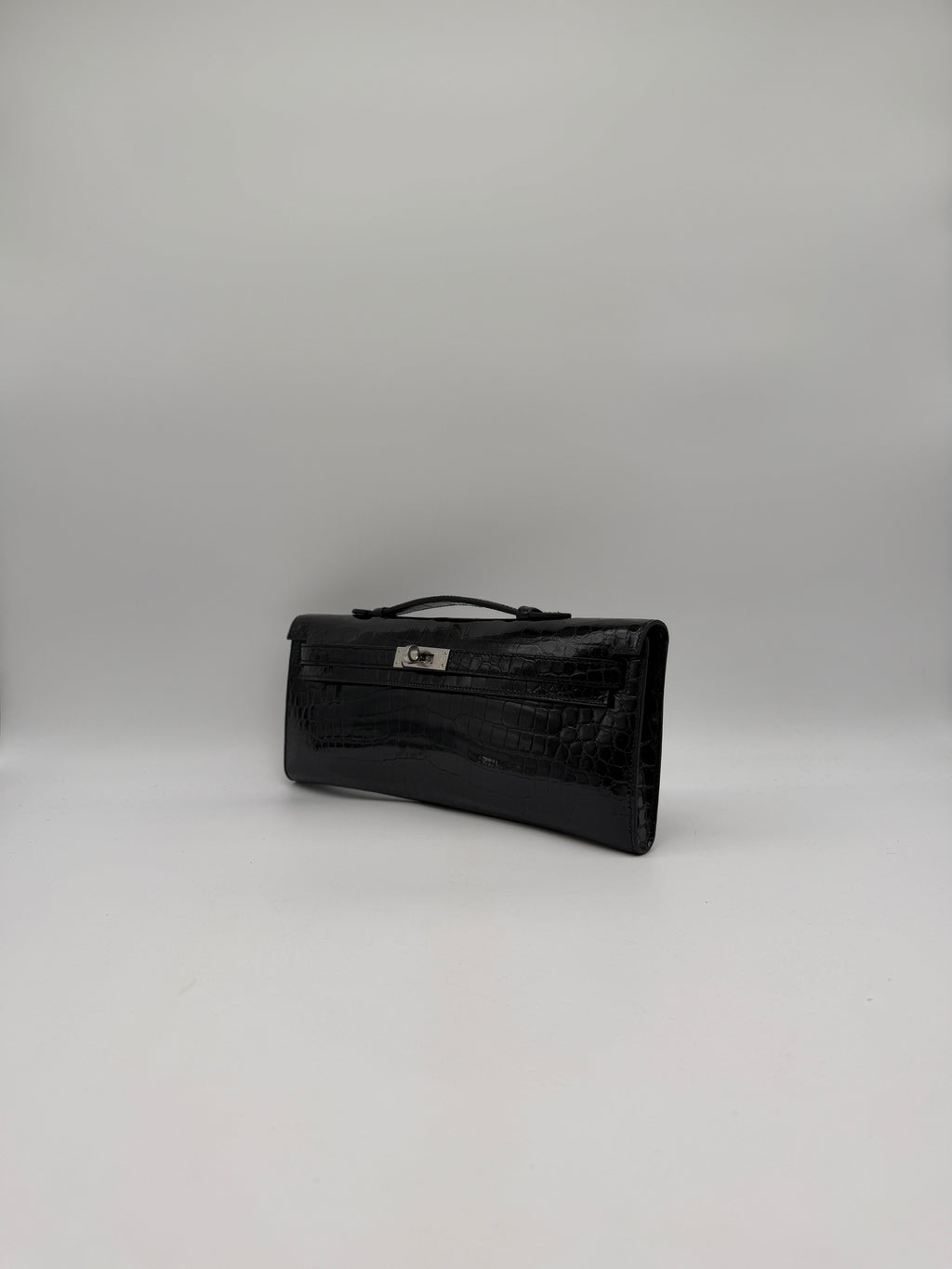 Hermès Kelly Cut Black Shiny Porosus Palladium Hardware