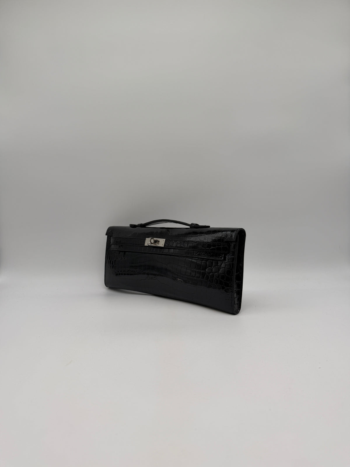 Hermès Kelly Cut Black Shiny Porosus Palladium Hardware