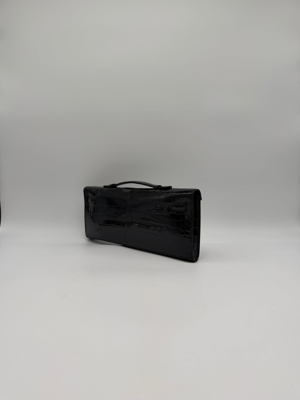 Hermès Kelly Cut Black Shiny Porosus Palladium Hardware