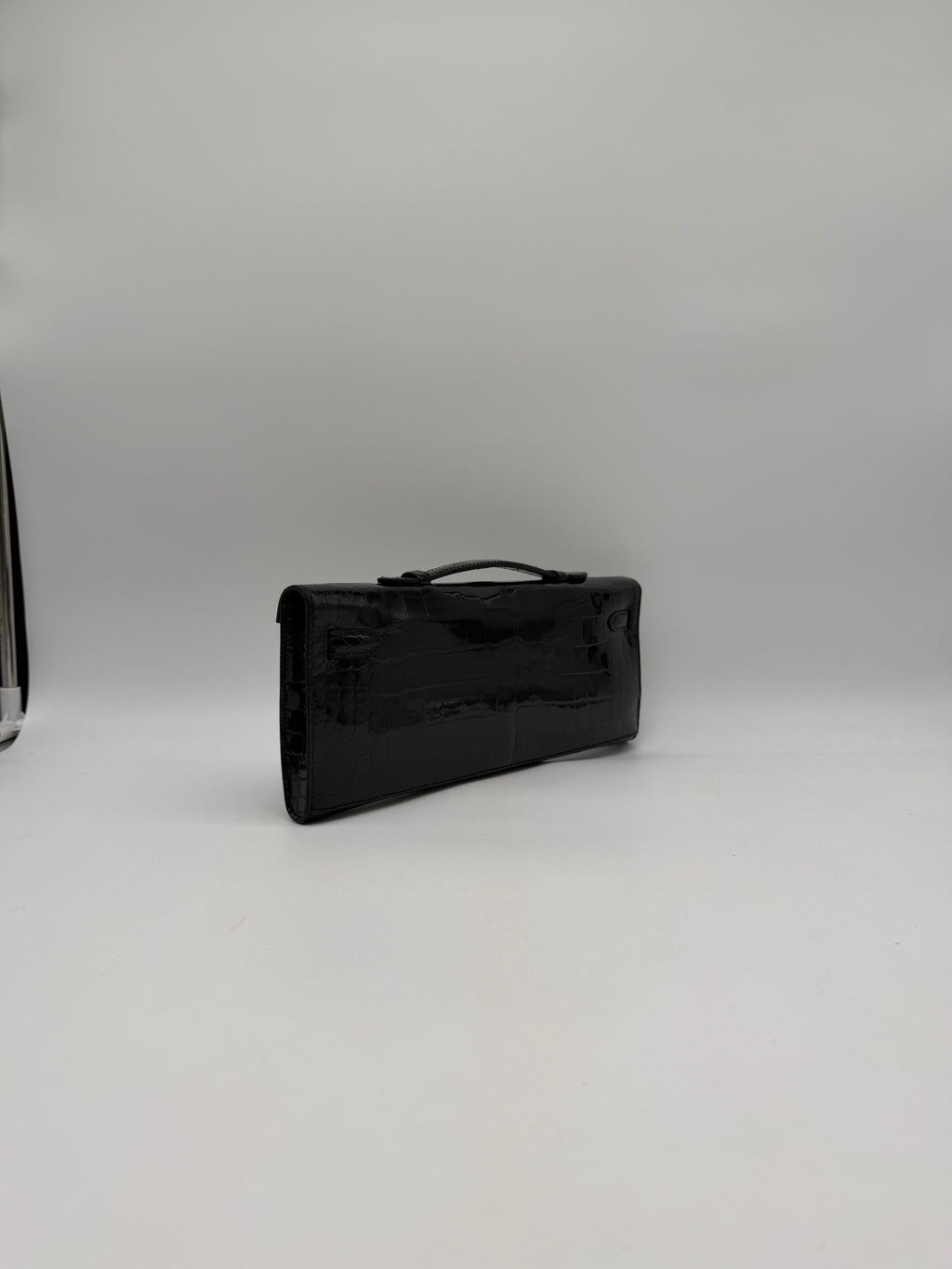 Hermès Kelly Cut Black Shiny Porosus Palladium Hardware