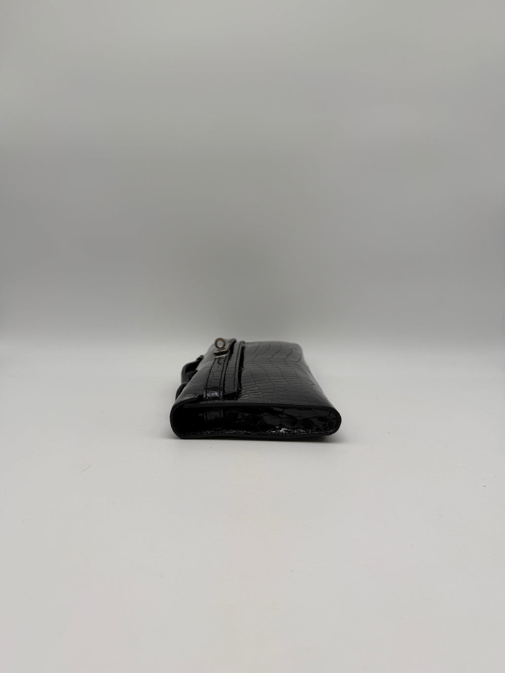 Hermès Kelly Cut Black Shiny Porosus Palladium Hardware