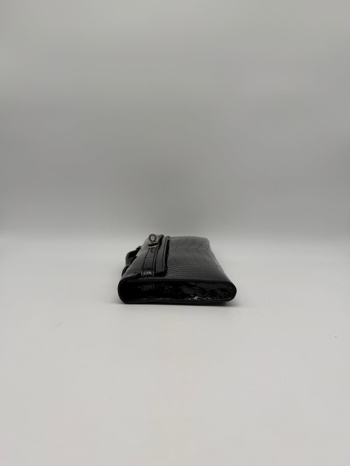 Hermès Kelly Cut Black Shiny Porosus Palladium Hardware