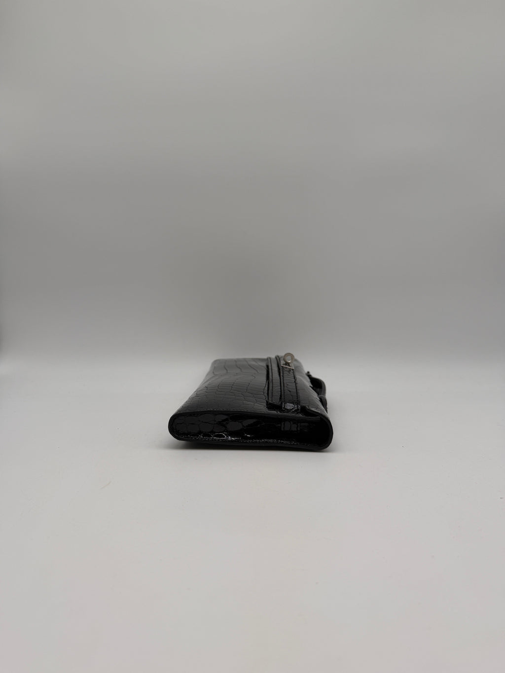 Hermès Kelly Cut Black Shiny Porosus Palladium Hardware
