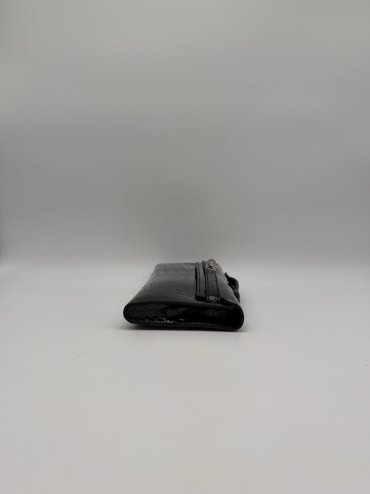 Hermès Kelly Cut Black Shiny Porosus Palladium Hardware