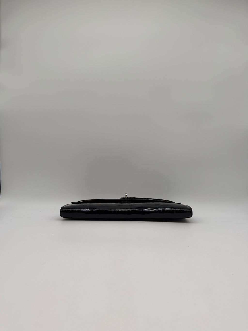 Hermès Kelly Cut Black Shiny Porosus Palladium Hardware
