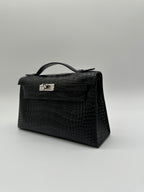 Hermès Kelly Pochette Black Matte Alligator Palladium Hardware