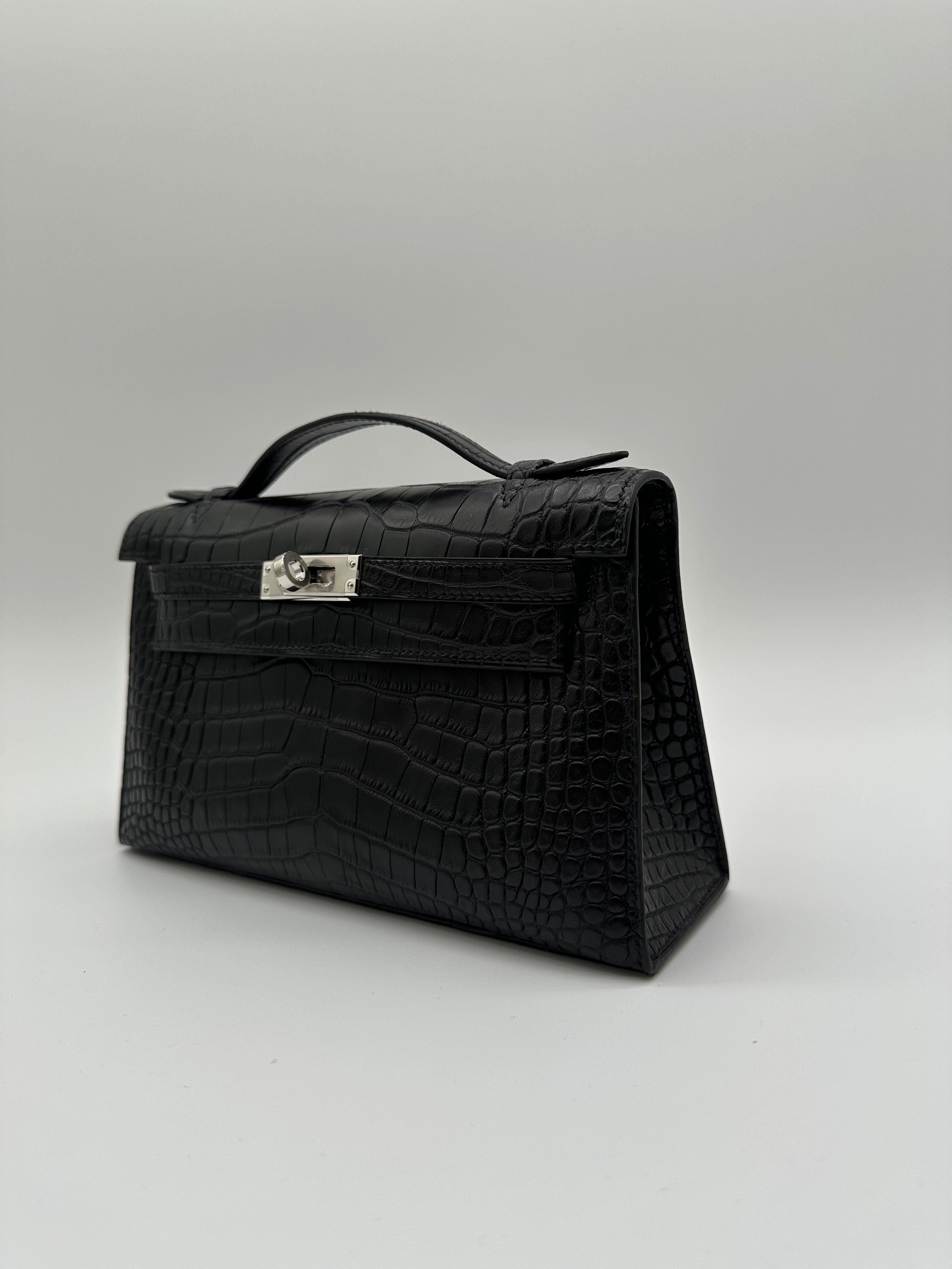 Hermès Kelly Pochette Black Matte Alligator Palladium Hardware