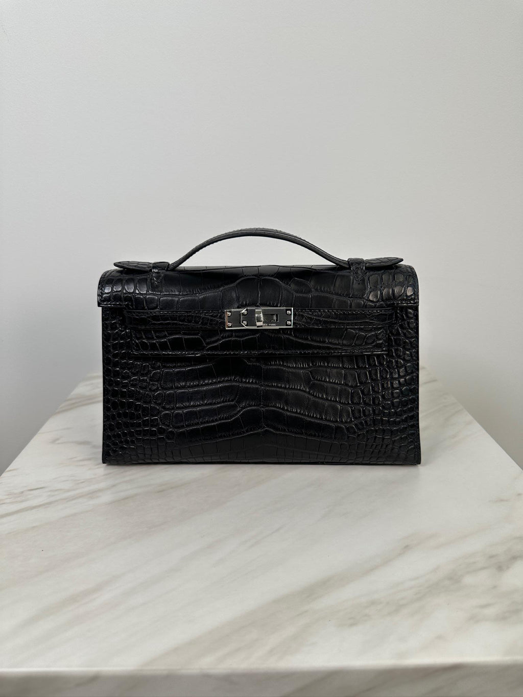 Hermès Kelly Pochette Black Matte Alligator Palladium Hardware